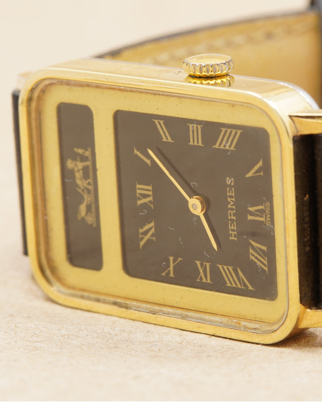 Hermès Calèche Rectangular — angled close-up of the dial and case