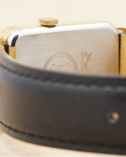 Hermès Calèche Rectangular — close-up of the case back and strap